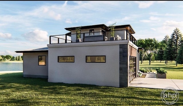 rear view of property with a yard and a balcony