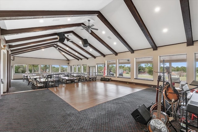 interior space featuring plenty of natural light, ceiling fan, high vaulted ceiling, and dark hardwood / wood-style flooring