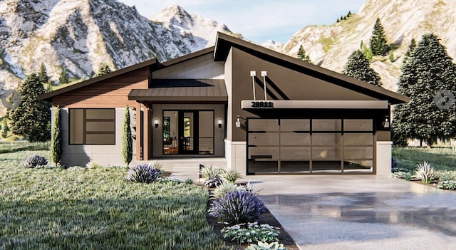 contemporary house with a mountain view and a garage