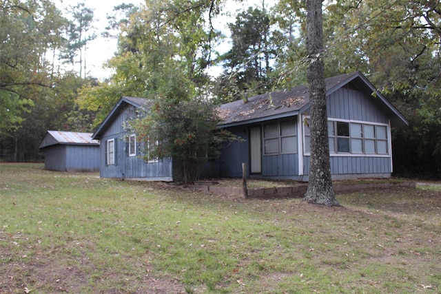 view of property exterior with a lawn