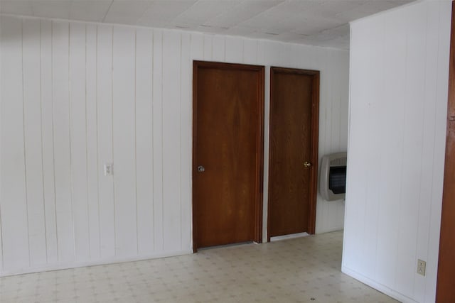 unfurnished bedroom featuring light tile flooring