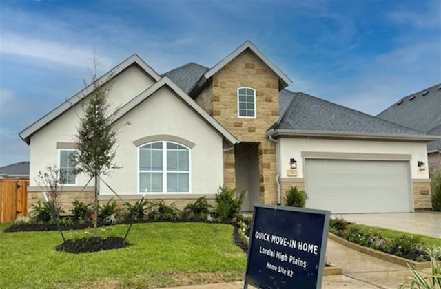 view of front of house with a front yard and a garage