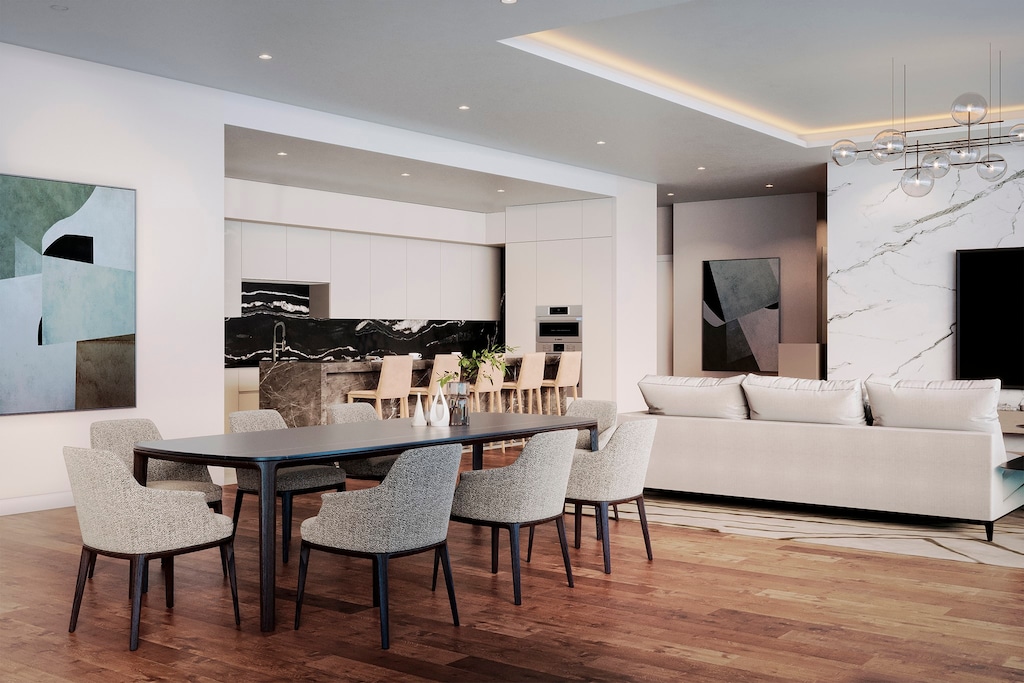 dining space with light hardwood / wood-style floors, a tray ceiling, and a chandelier