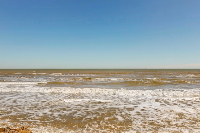 property view of water featuring a beach view