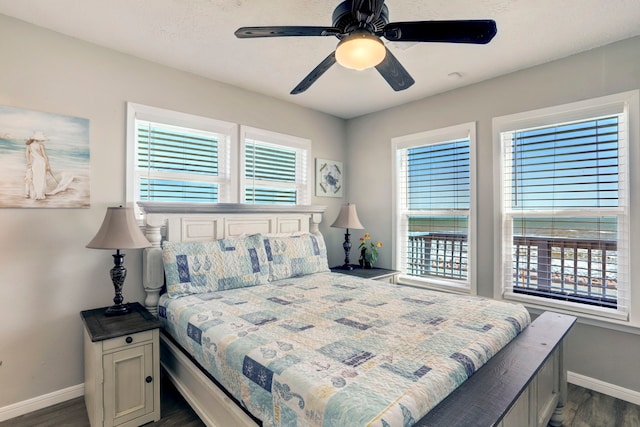 bedroom featuring dark hardwood / wood-style flooring and ceiling fan