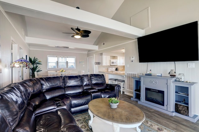 living room with ceiling fan, lofted ceiling, and dark hardwood / wood-style floors