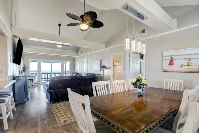 dining space with high vaulted ceiling, dark hardwood / wood-style floors, beam ceiling, and ceiling fan