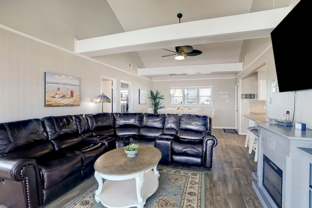 living room featuring ceiling fan, dark hardwood / wood-style floors, and lofted ceiling with beams