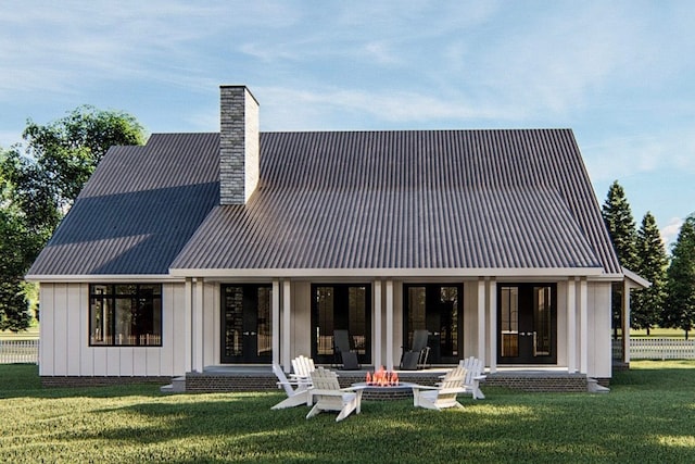 rear view of house featuring a yard