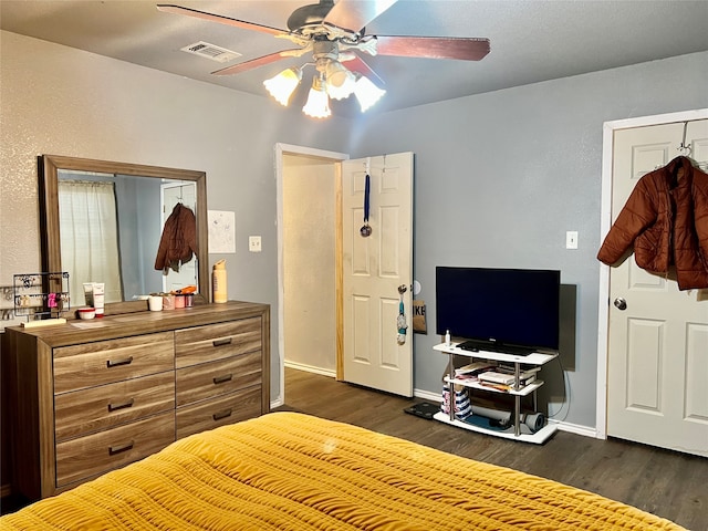 bedroom featuring dark hardwood / wood-style floors and ceiling fan