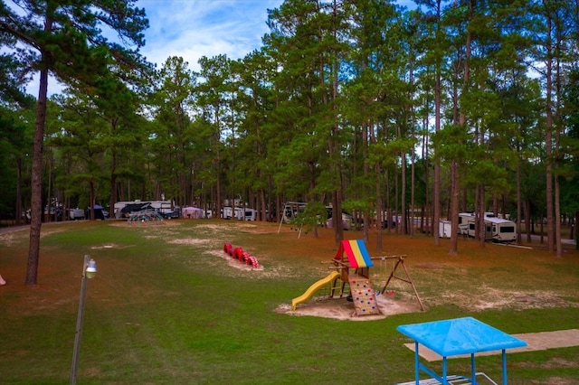 surrounding community with a playground and a lawn