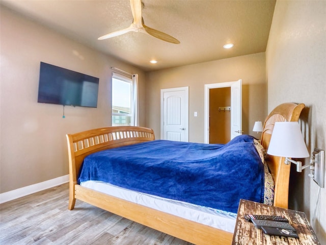 bedroom featuring light hardwood / wood-style floors and ceiling fan