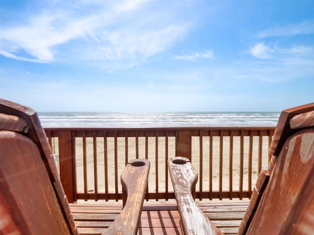 exterior space featuring a water view and a view of the beach