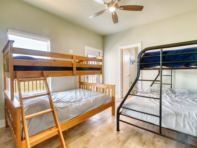 bedroom featuring light hardwood / wood-style floors and ceiling fan