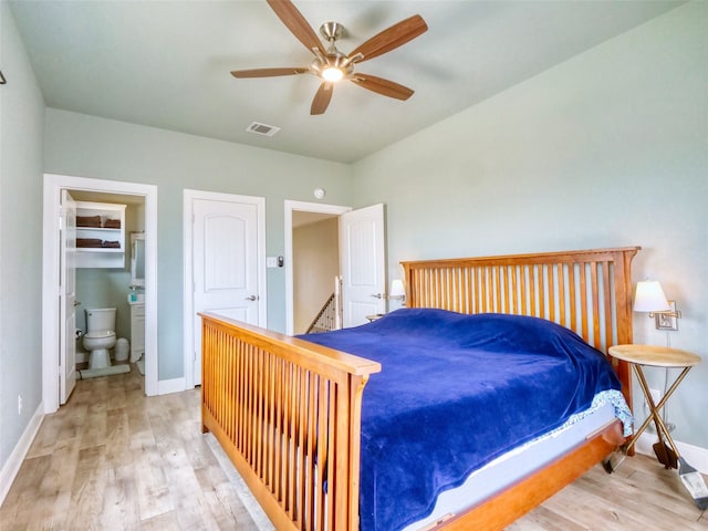 bedroom with ensuite bath, ceiling fan, and light wood-type flooring