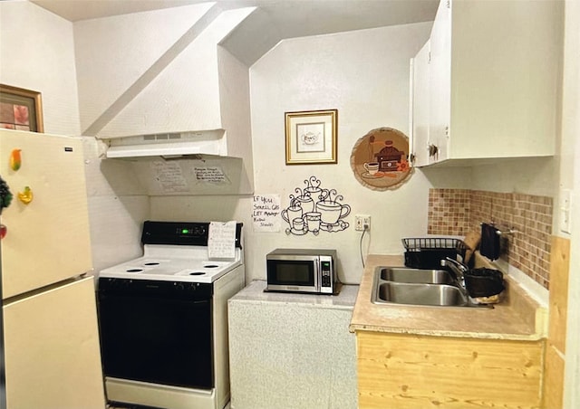 kitchen featuring custom exhaust hood, white appliances, white cabinetry, and sink