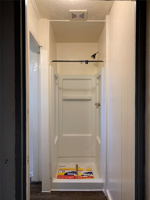 bathroom with a textured ceiling