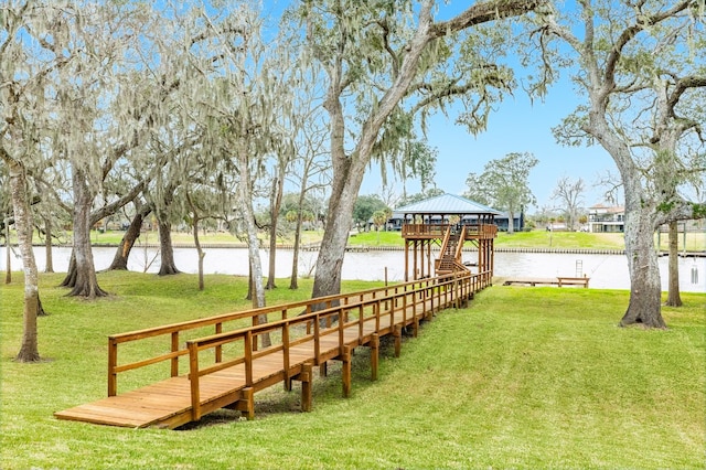 surrounding community with a water view, a yard, and a gazebo