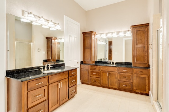 bathroom with tile floors and double vanity