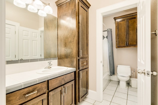 full bathroom featuring vanity, tile floors, shower / tub combo with curtain, and toilet