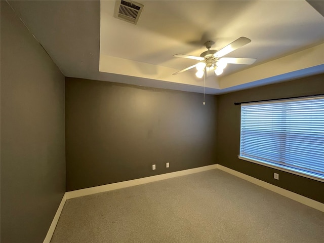 9822 Samantha Suzanne Ct, Houston, TX 77025 - unfurnished room featuring ceiling fan, a tray ceiling, and carpet
