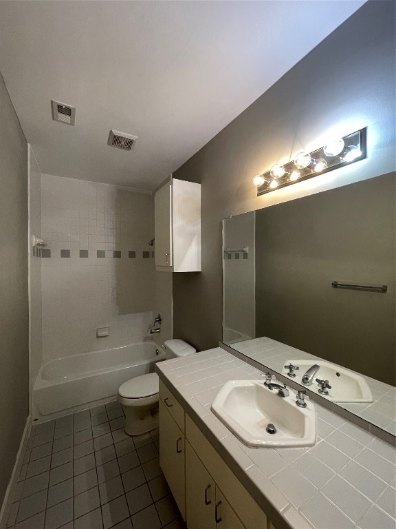 9822 Samantha Suzanne Ct, Houston, TX 77025 - full bathroom with tiled shower / bath, tile floors, toilet, and vanity with extensive cabinet space