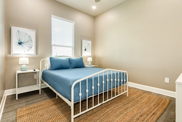 bedroom with hardwood / wood-style floors