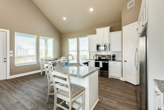 kitchen featuring white cabinetry, stainless steel appliances, sink, and dark hardwood / wood-style floors