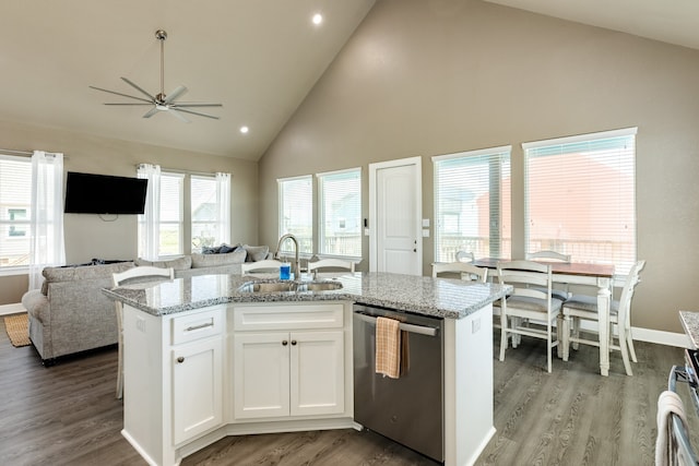 kitchen featuring a center island with sink, high vaulted ceiling, sink, white cabinets, and dishwasher