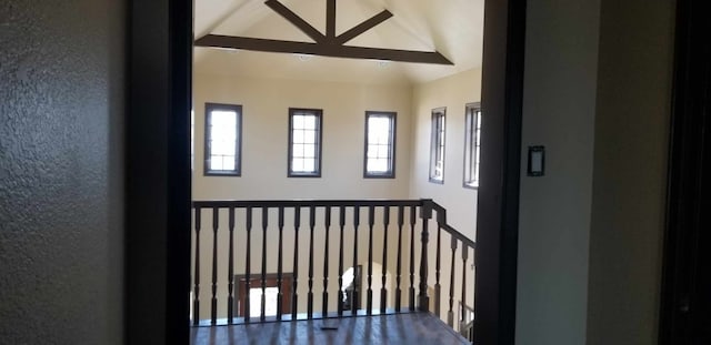 interior space featuring lofted ceiling with beams