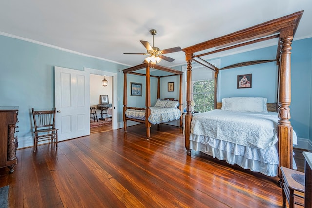 bedroom featuring ceiling fan, dark wood-type flooring, and ornamental molding