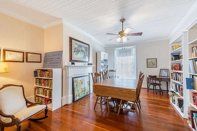 dining area featuring crown molding, dark hardwood / wood-style floors, and ceiling fan