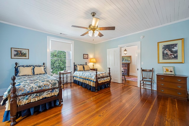 bedroom with wooden ceiling, ceiling fan, dark hardwood / wood-style flooring, and ornamental molding