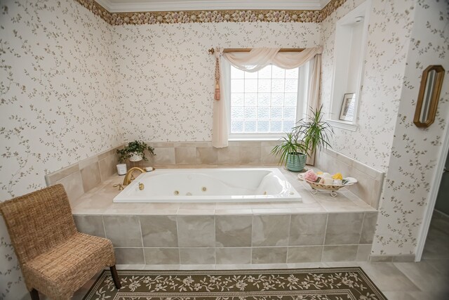 bathroom featuring tiled bath, ornamental molding, and tile floors