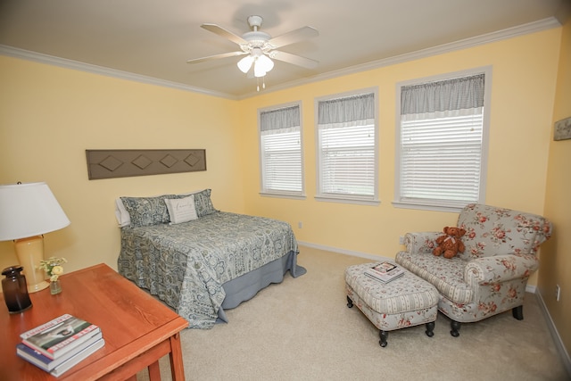 carpeted bedroom featuring multiple windows, crown molding, and ceiling fan