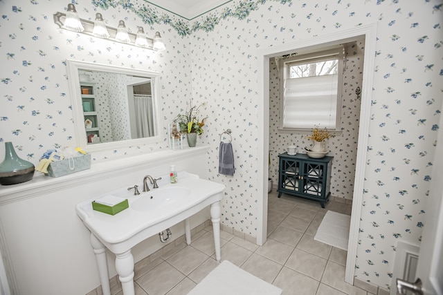 bathroom with tile floors and sink