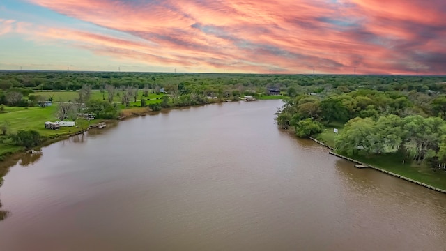 aerial view at dusk with a water view