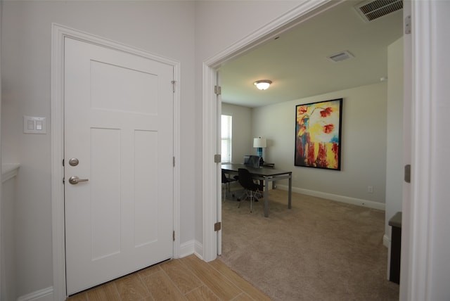 entrance foyer with light colored carpet