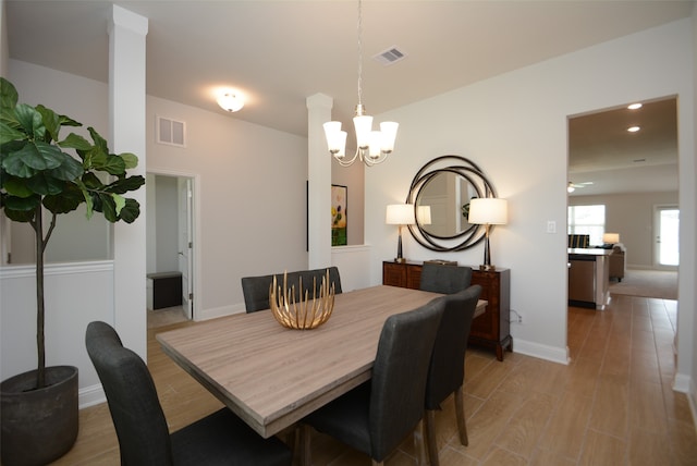 dining room featuring a chandelier and hardwood / wood-style flooring