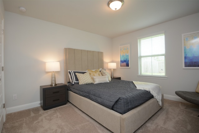 bedroom with light colored carpet