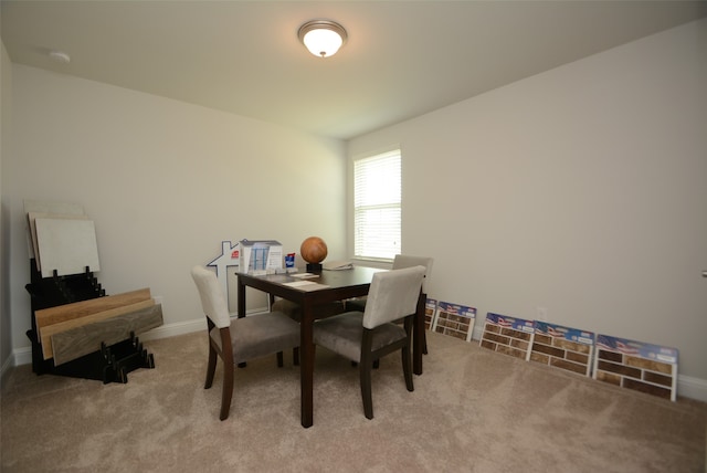 dining space with light colored carpet