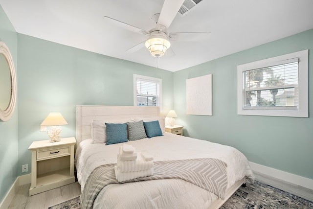 bedroom featuring ceiling fan and hardwood / wood-style flooring