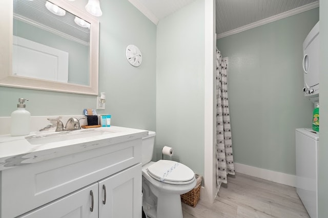 bathroom featuring toilet, ornamental molding, large vanity, and hardwood / wood-style flooring