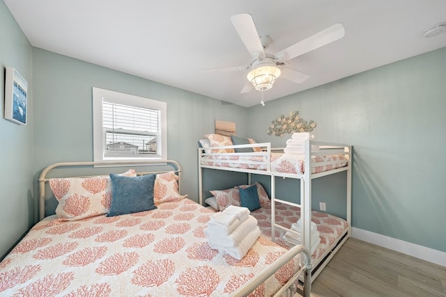 bedroom featuring ceiling fan and hardwood / wood-style flooring