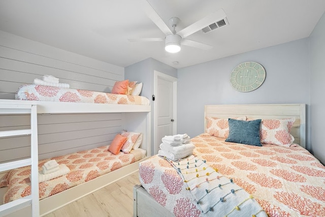 bedroom featuring ceiling fan and hardwood / wood-style floors