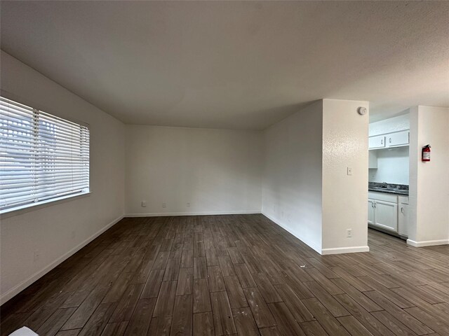 spare room featuring dark hardwood / wood-style floors