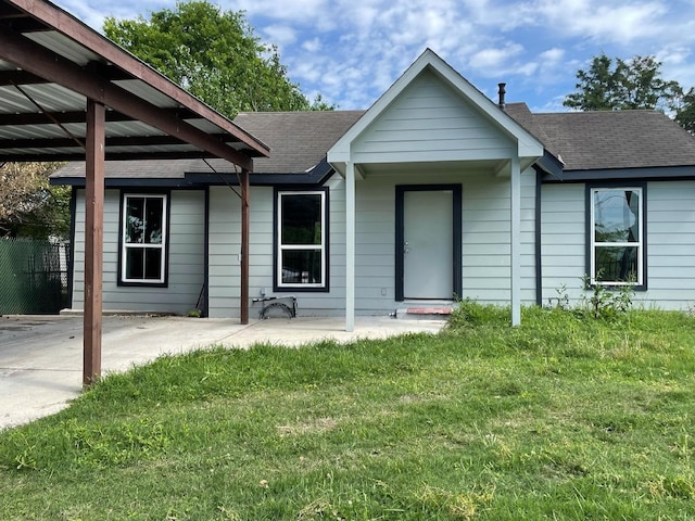 ranch-style home with a front lawn