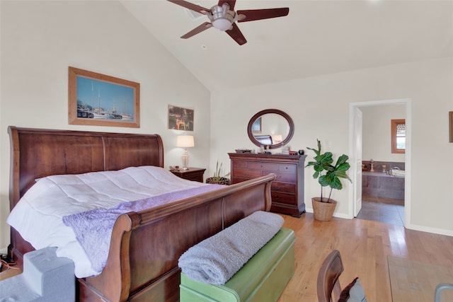 bedroom with high vaulted ceiling, connected bathroom, ceiling fan, and light tile floors