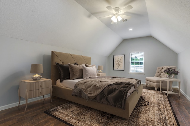 bedroom with a textured ceiling, vaulted ceiling, ceiling fan, and dark hardwood / wood-style flooring