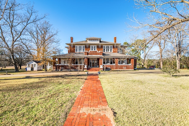 view of front of home with a front lawn and a porch